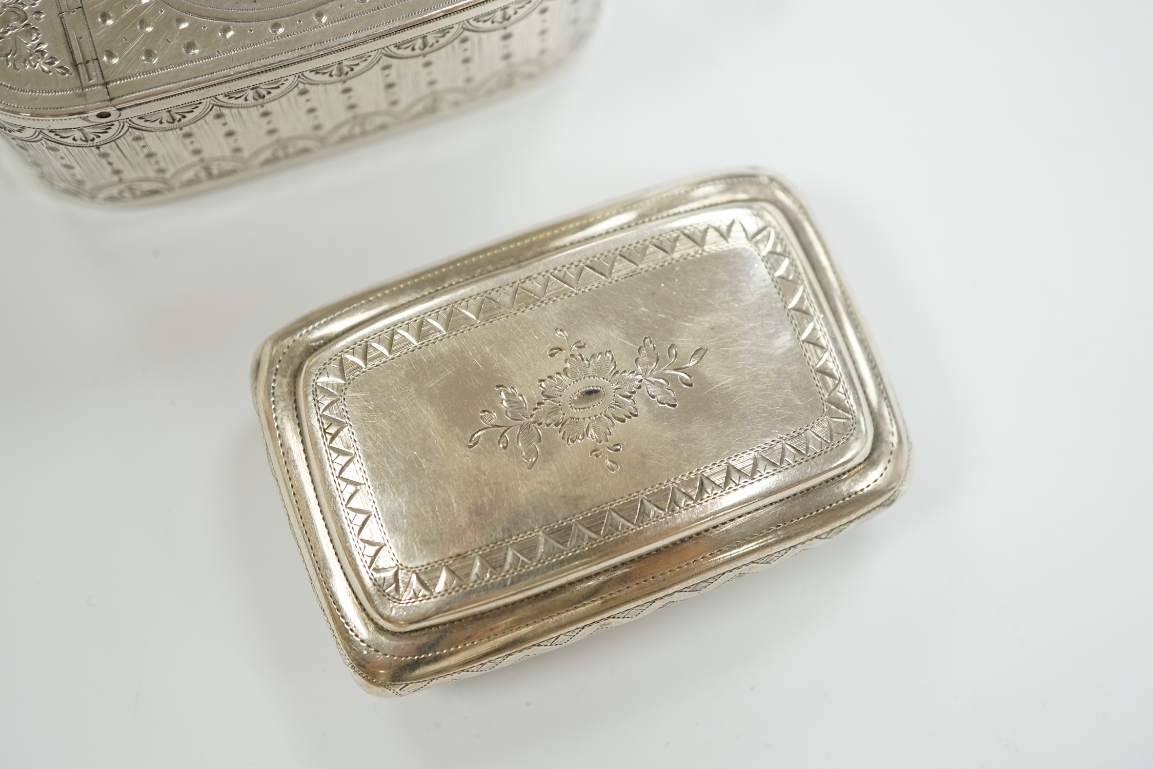 A George III engraved silver oval snuff box, by Phipps & Robinson, London, 1793, 70mm and one other Georgian silver snuff box.
